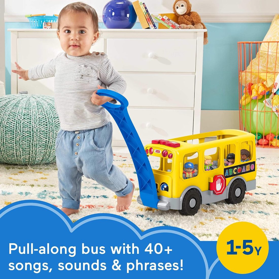 Toddler pulling the Little People big school bus